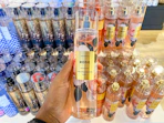 a bath and body works fine fragrance mist held in front of other mists display