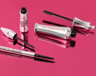 eyebrow makeup products on a pink surface