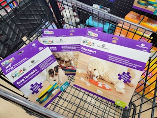outward hound puzzle dog toys in a cart