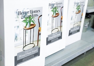 a row of better homes and gardens wood plant stands in white boxes