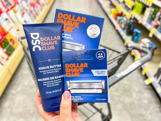 hand holding three dollar shave club products