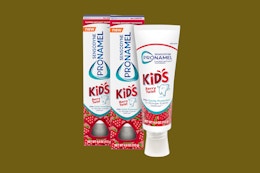 sensodyne kids toothpaste on an olive background