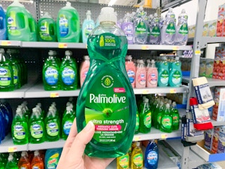 hand holding a green bottle of Palmolive dish soap