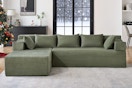 Lifestyle image of the green Behost sectional sofa in winter home setting