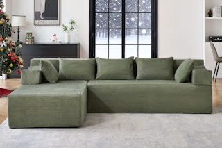 Lifestyle image of the green Behost sectional sofa in winter home setting