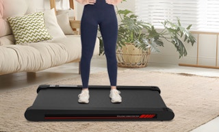 a person on a walking pad in a room