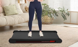 a person on a walking pad in a room