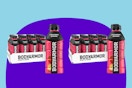 Two 12 packs of body armour sports drink in bottles, strawberry banana flavor