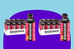 Two 12 packs of body armour sports drink in bottles, strawberry banana flavor