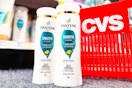 two bottles of pantene shampoo next to a cvs shopping basket