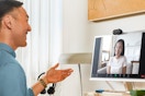 a man and woman talking on a logitech webcam