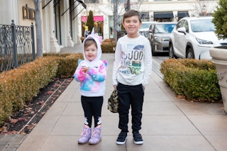 Girl in FabKids unicorn hoodie and boy in FabKids joggers