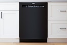 Lifestyle image of the Bosch 100 Series 24-in Front Control Built-in Dishwasher installed in a kitchen