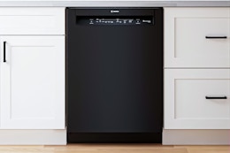 Lifestyle image of the Bosch 100 Series 24-in Front Control Built-in Dishwasher installed in a kitchen
