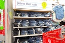 target cart parked in front of kids' jeans sitting on a shelf