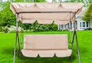 Lifestyle image of the beige GVDV Outdoor Porch Swing outdoors 