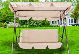 Lifestyle image of the beige GVDV Outdoor Porch Swing outdoors 