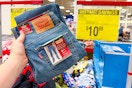 hand holding a pair of levis boys jeans at sams club