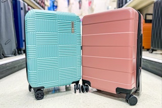 american tourister luggage sitting in a target aisle