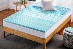 Lifestyle image of the Zinus Spa 1-inch Green Tea Gel Memory Foam Queen Mattress Topper in a bedroom setting