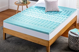 Lifestyle image of the Zinus Spa 1-inch Green Tea Gel Memory Foam Queen Mattress Topper in a bedroom setting