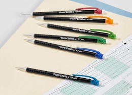 mechanical pencils on a table with an exam sheet