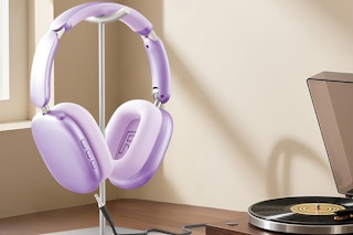 purple headphones on stand next to record player