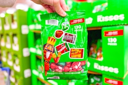 hand holding a bag of hersheys christmas candy