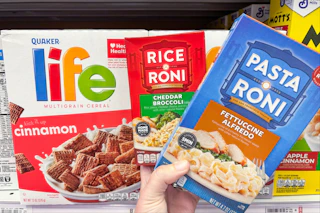 hand holding pasta-roni next to life cereal