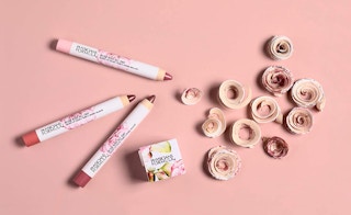 lipstick sticks on a pink background