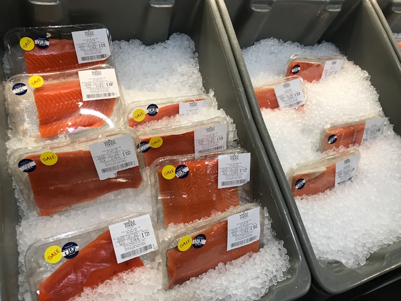 Whole Foods salmon on ice inside the store.