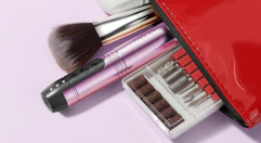 a nail drill and drill bit set in a red pouch