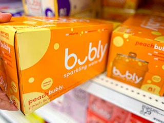 hand grabbing Bubly pack off store shelf