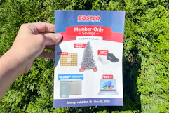 hand holding costco november 2026 coupon book