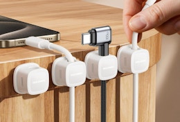 cords in magnetic clips on the side of a table 
