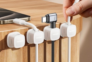 cords in magnetic clips on the side of a table 