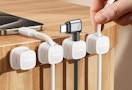 cords in magnetic clips on the side of a table