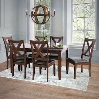a dining table with 6 chairs displayed in a home