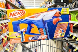 nerf blaster on top of shopping cart