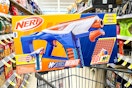 nerf blaster on top of shopping cart