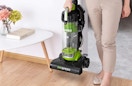 a person holding a vacuum