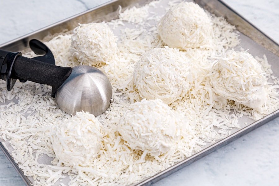 scoops of Breyers ice cream made into snow balls to make a snowman