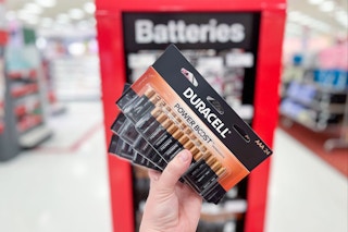 Duracell 24-Pack of AAA Batteries held up in front of batteries display in Target store