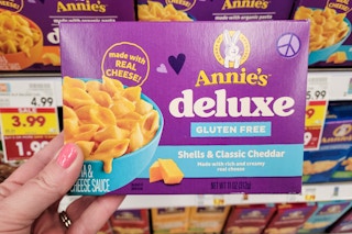 hand holding annies deluxe mac and cheese at kroger