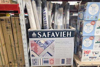 box containing 8 by 10 outdoor rugs