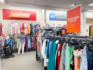 a woman shopping in the womens clearance section at kohls