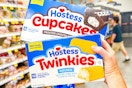 hand holding boxes of hostess snack cakes