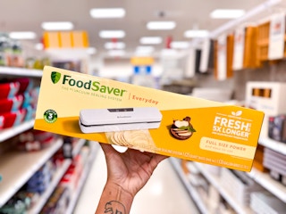 hand holding the FoodSave vacuum sealer