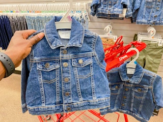 hand holding baby denim jacket