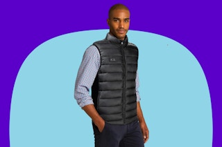 Man wearing the Loowoko Heated Vest for Men on a blue background.